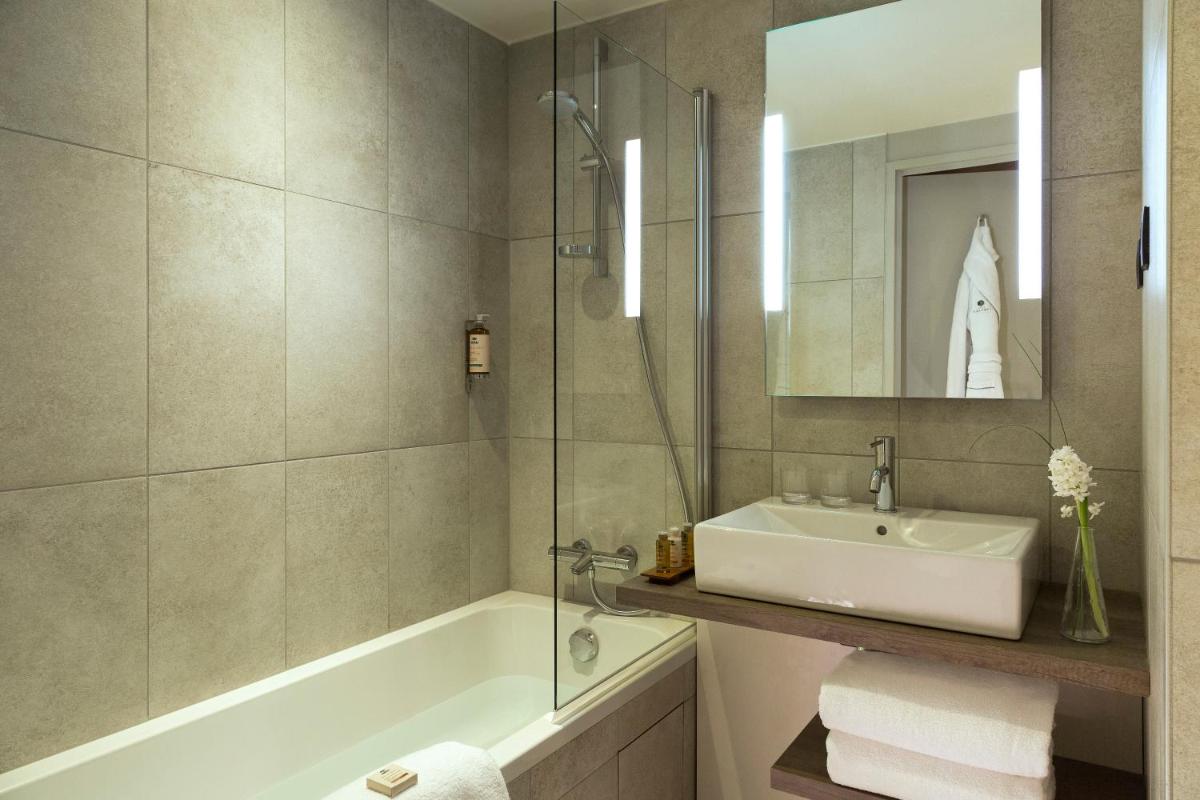 Salle de bains dans l'établissement Heliopic Hotel & Spa
