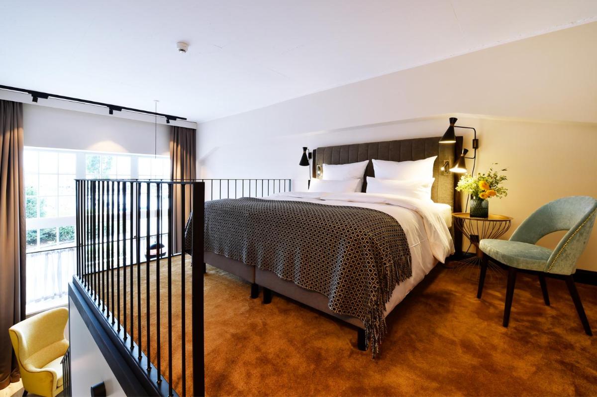 Ein Bett oder Betten in einem Zimmer der Unterkunft Das James
