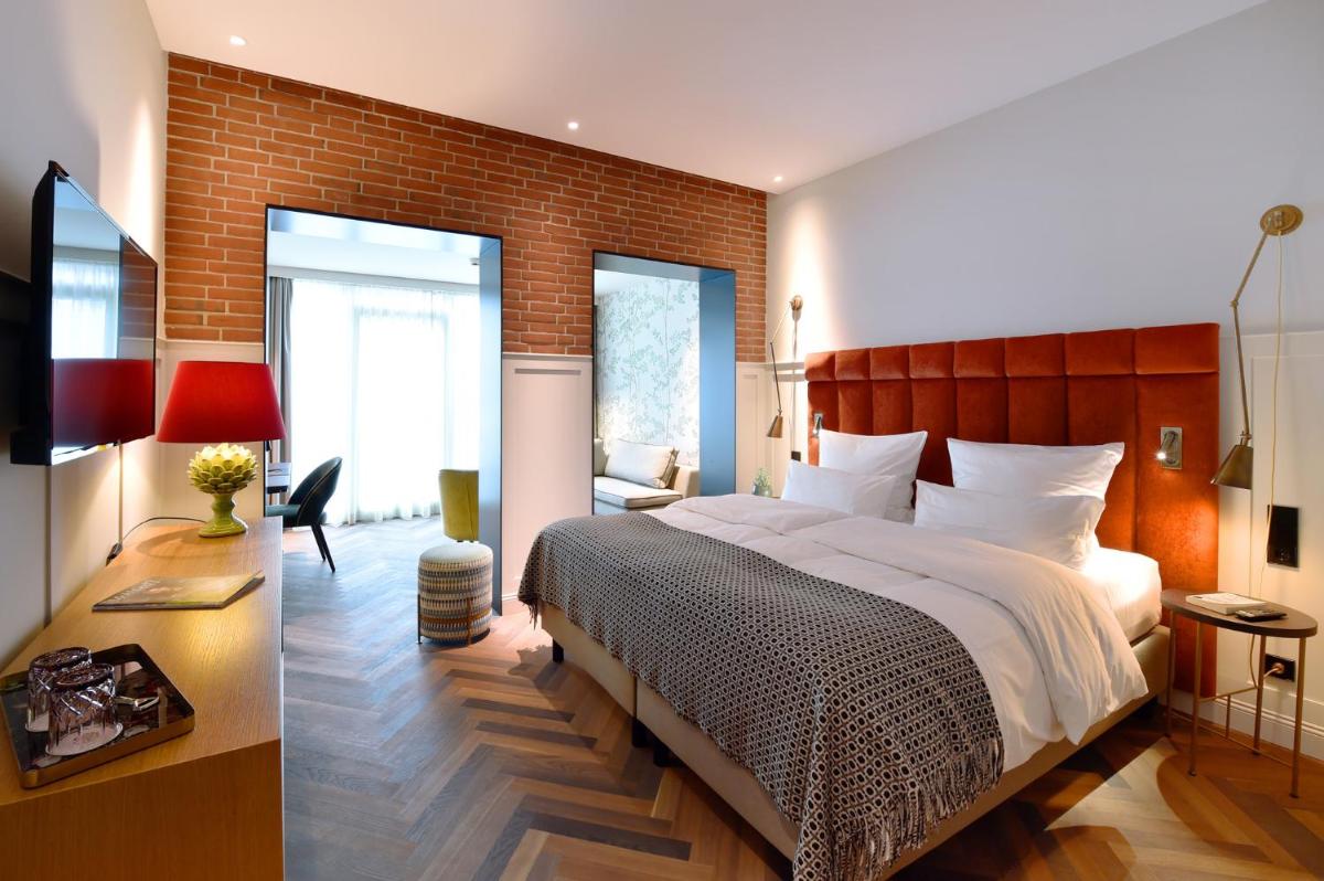 Ein Bett oder Betten in einem Zimmer der Unterkunft Das James