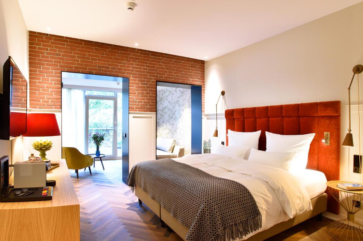 Ein Bett oder Betten in einem Zimmer der Unterkunft Das James
