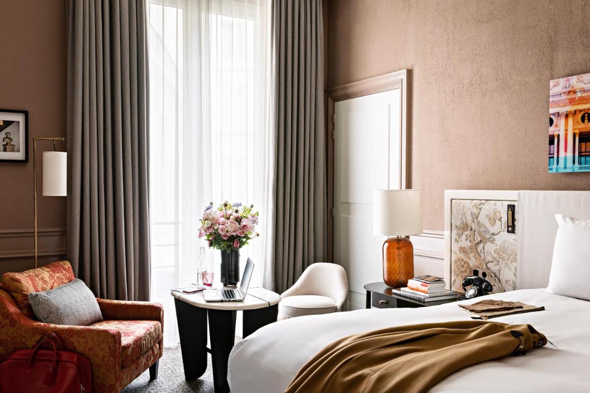 Un ou plusieurs lits dans un hébergement de l'établissement Sofitel Le Scribe Paris Opera