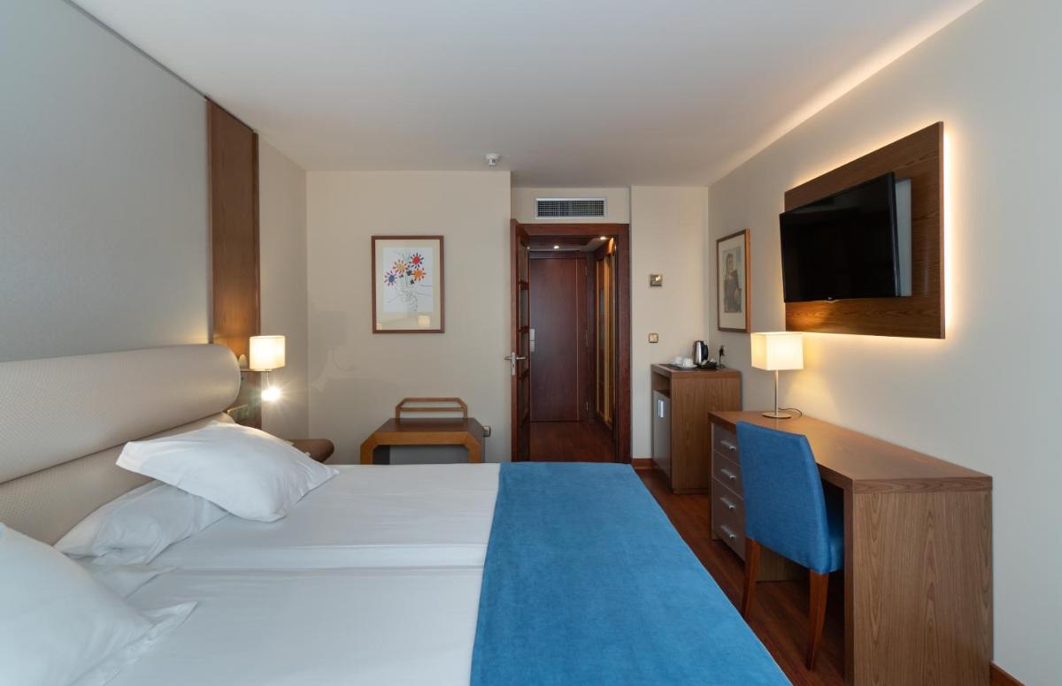 Cama o camas de una habitación en Hotel MS Maestranza Málaga