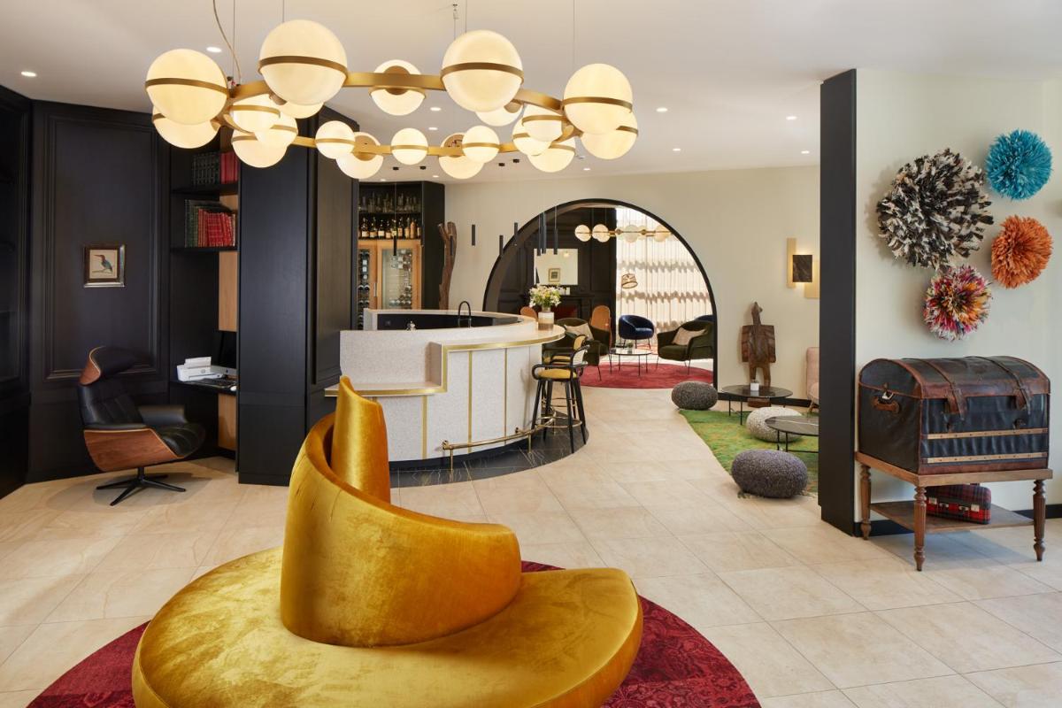 Coin salon dans l'établissement Les Nomades Beaune