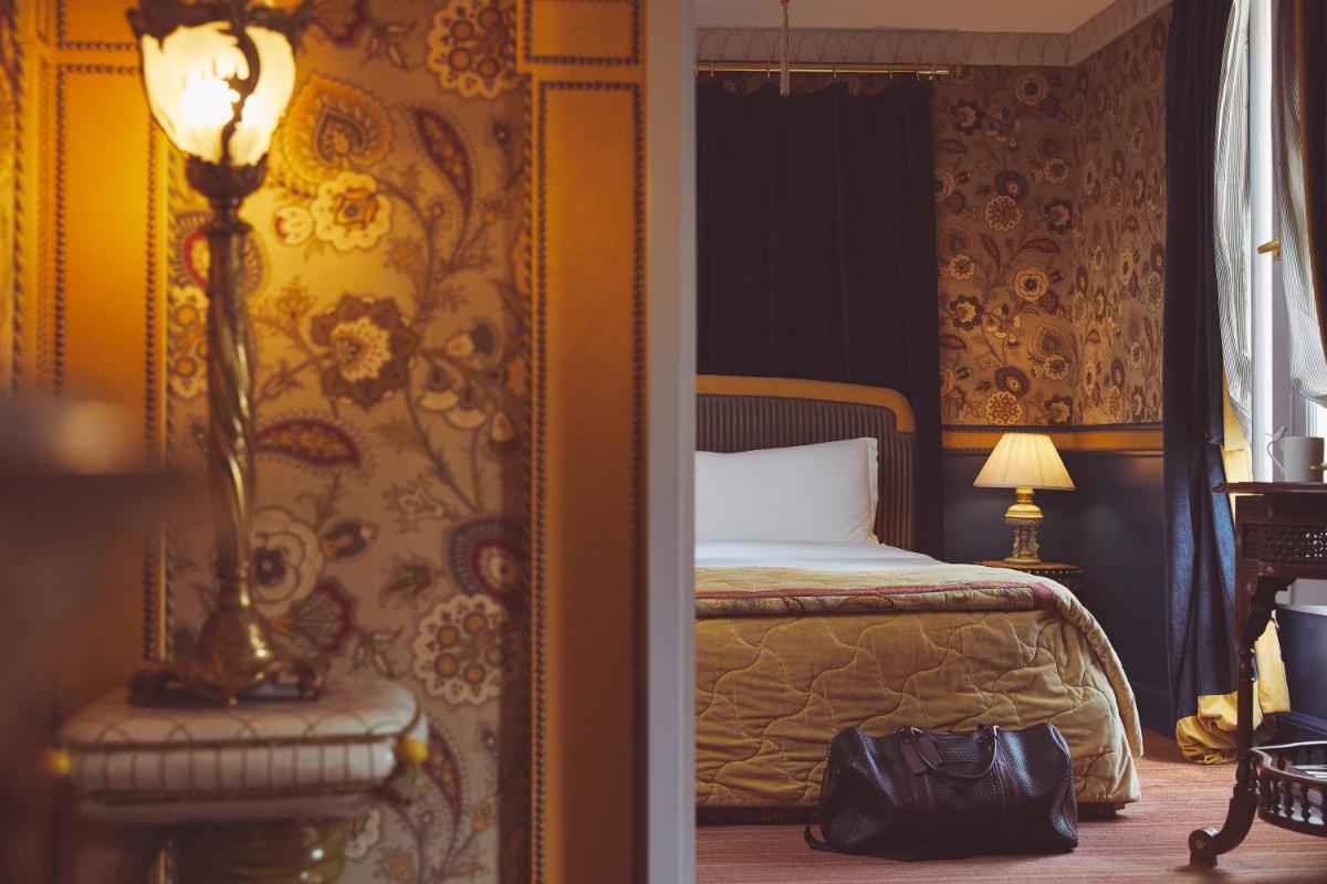 Un ou plusieurs lits dans un hébergement de l'établissement L'Hôtel