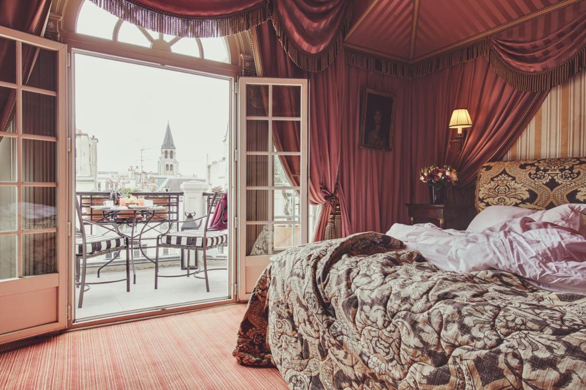 Un ou plusieurs lits dans un hébergement de l'établissement L'Hôtel