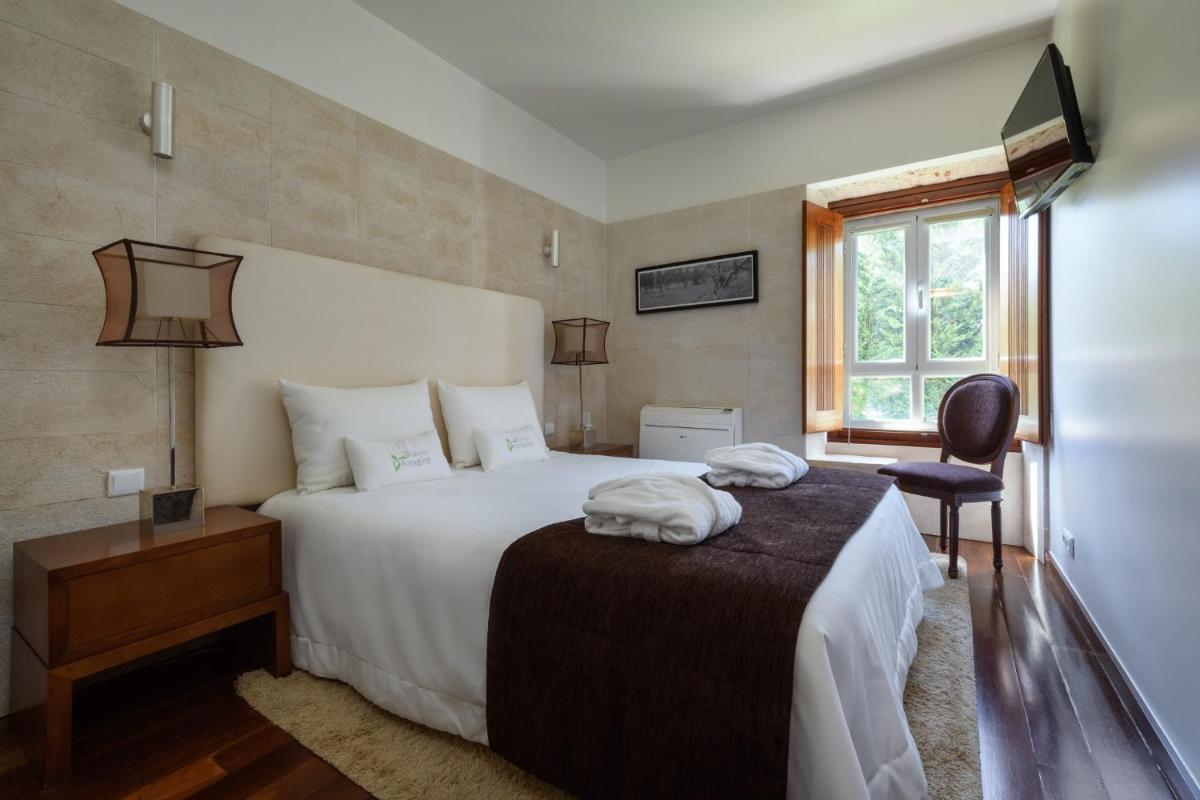 Uma cama ou camas num quarto em Hotel de Charme Casa da Amieira
