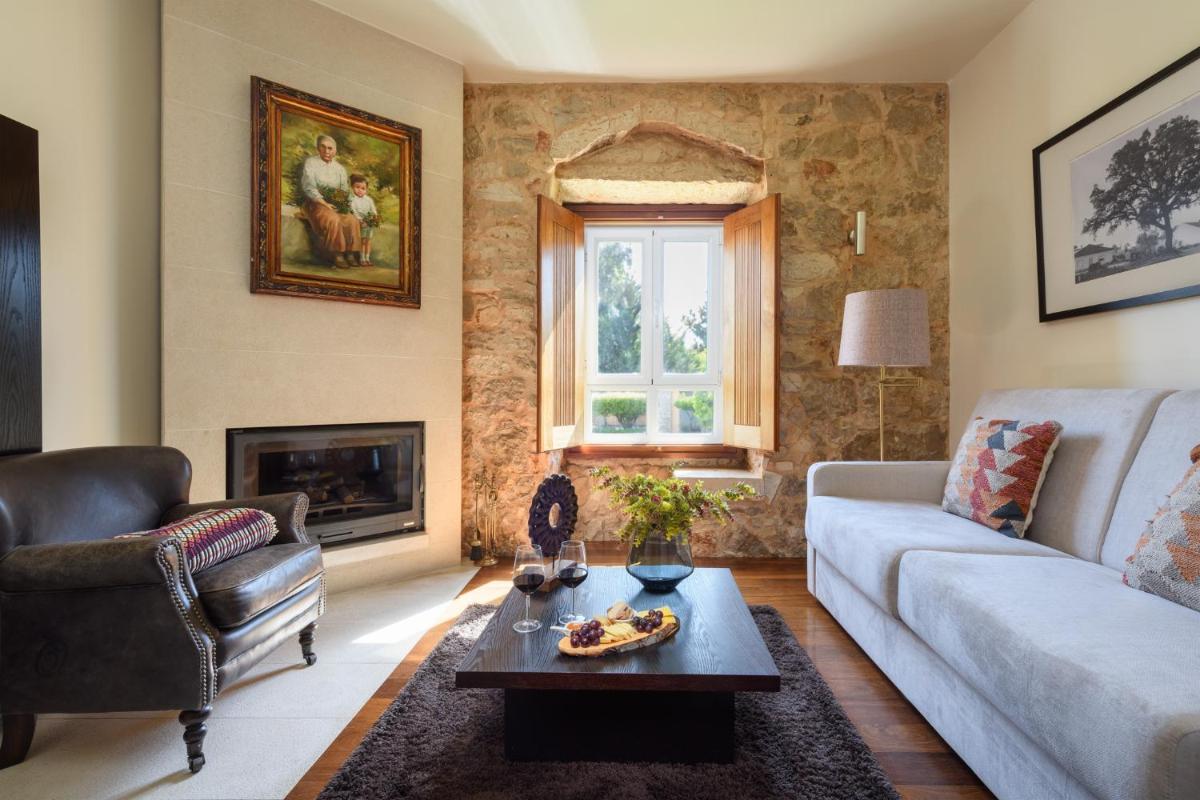 Uma área de estar em Hotel de Charme Casa da Amieira