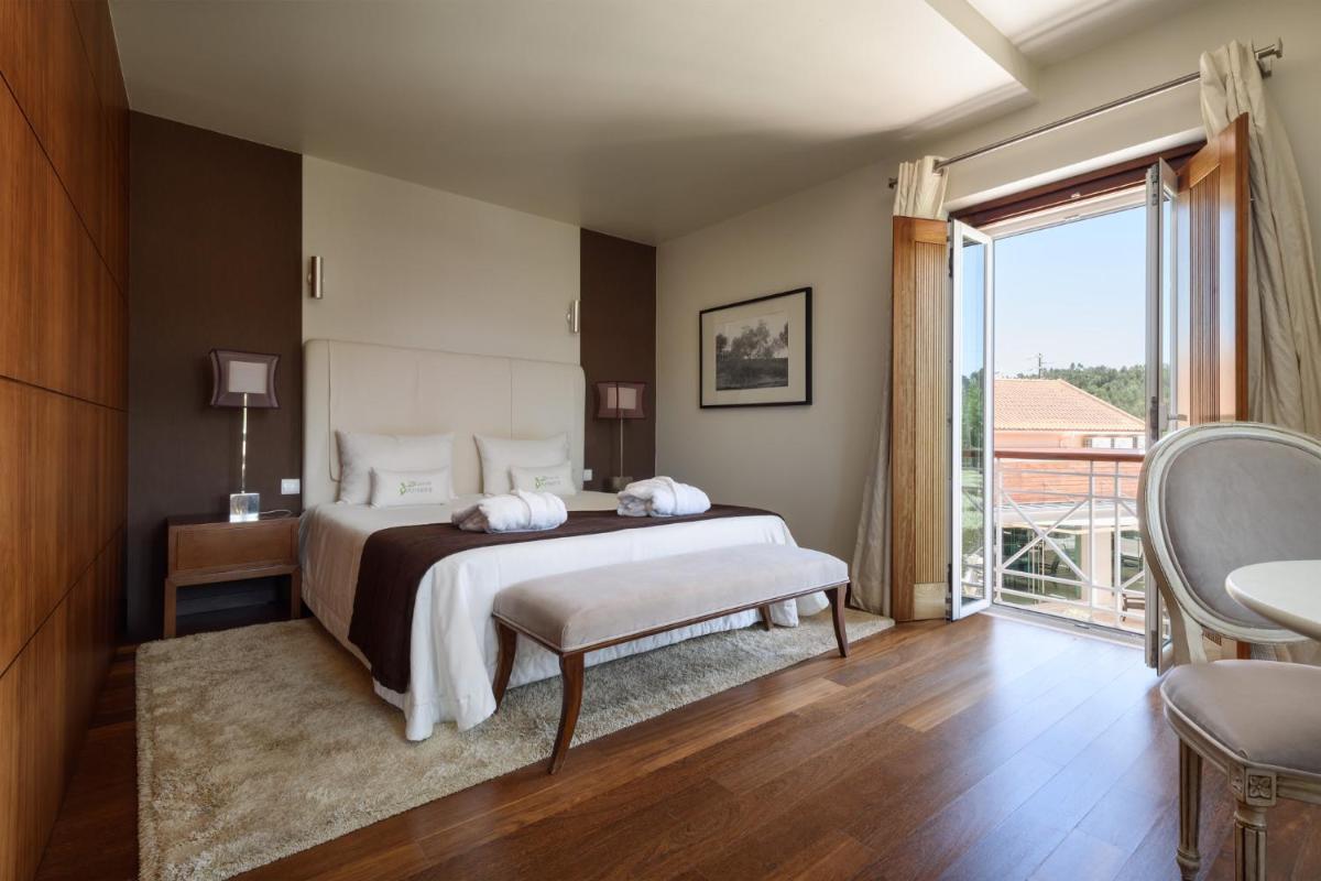 Uma cama ou camas num quarto em Hotel de Charme Casa da Amieira