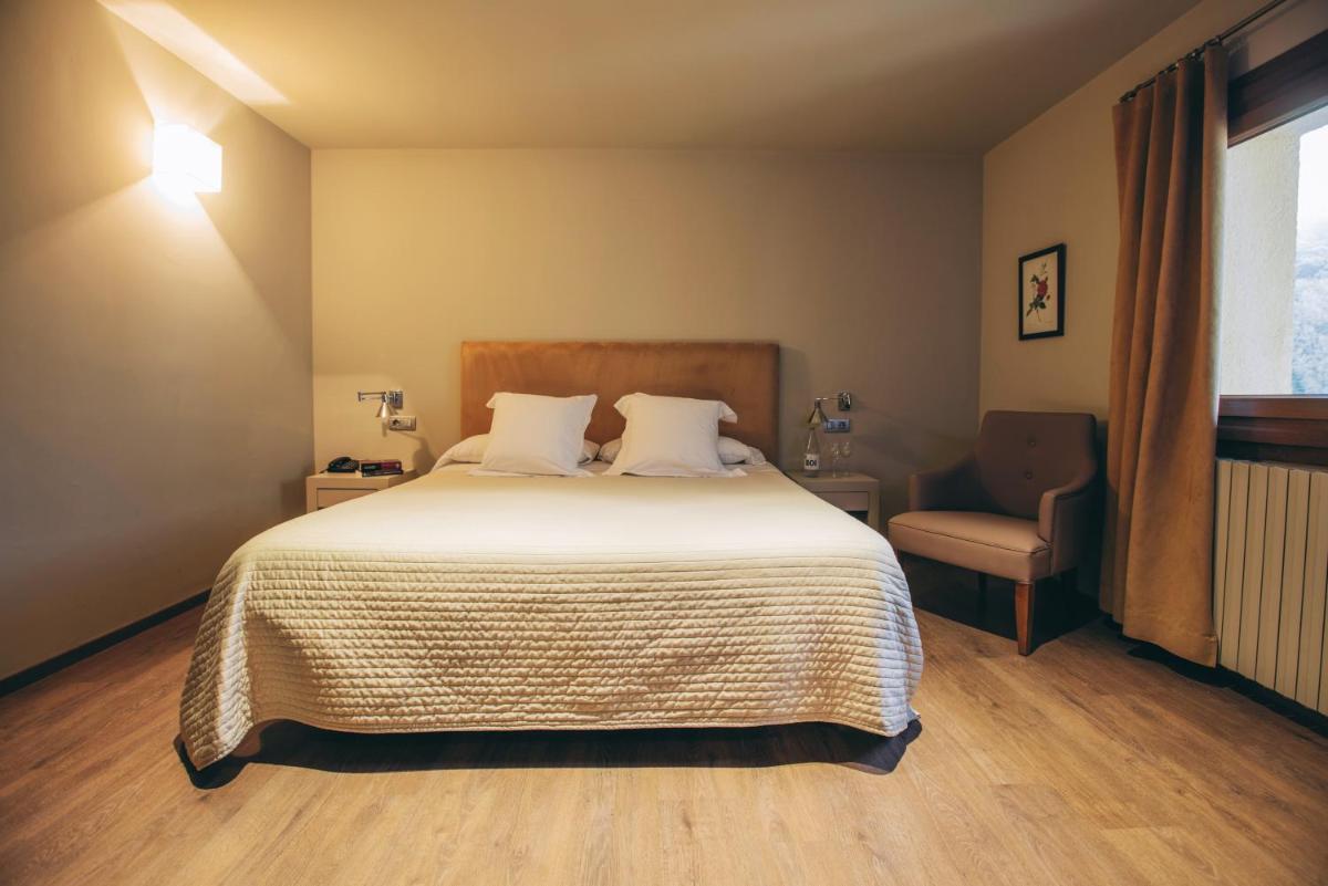Cama o camas de una habitación en Hotel Manantial