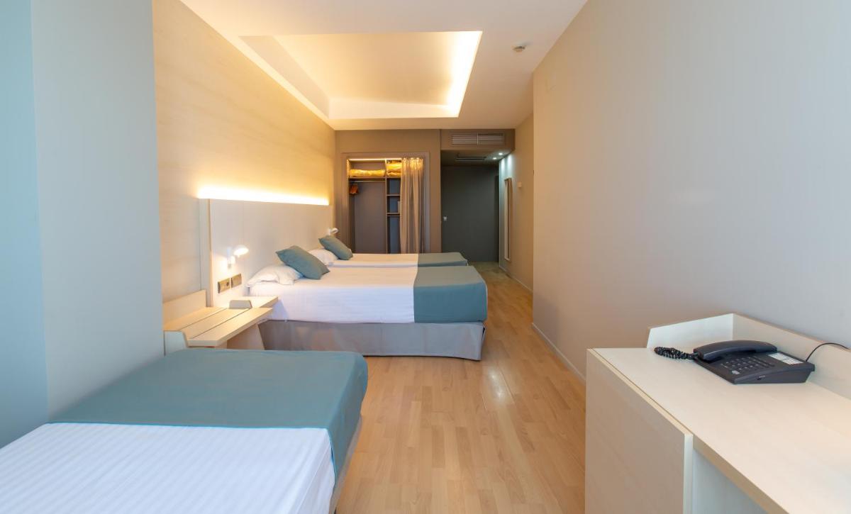 Cama o camas de una habitación en Hotel Olympia Valencia