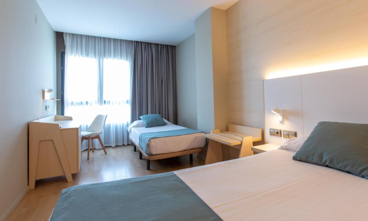 Cama o camas de una habitación en Hotel Olympia Valencia