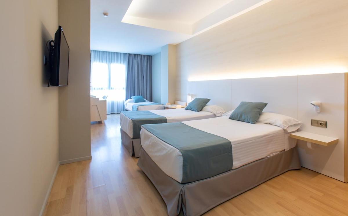 Cama o camas de una habitación en Hotel Olympia Valencia