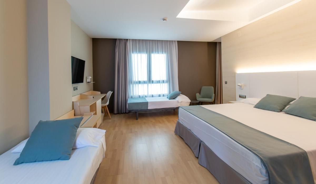 Cama o camas de una habitación en Hotel Olympia Valencia
