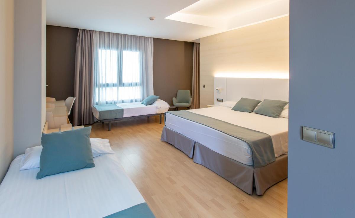 Cama o camas de una habitación en Hotel Olympia Valencia