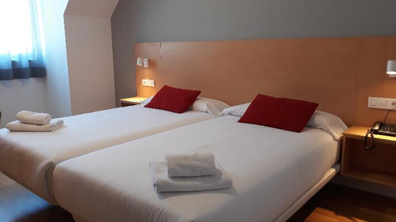 Cama o camas de una habitación en Hotel Spa Odeón