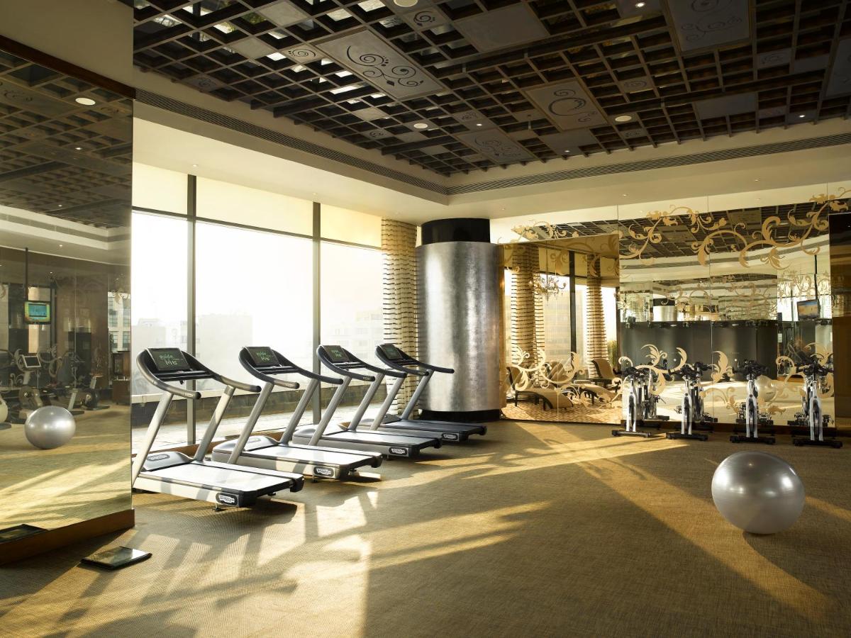 a gym with a row of chairs in a room at Sofitel Mumbai BKC in Mumbai