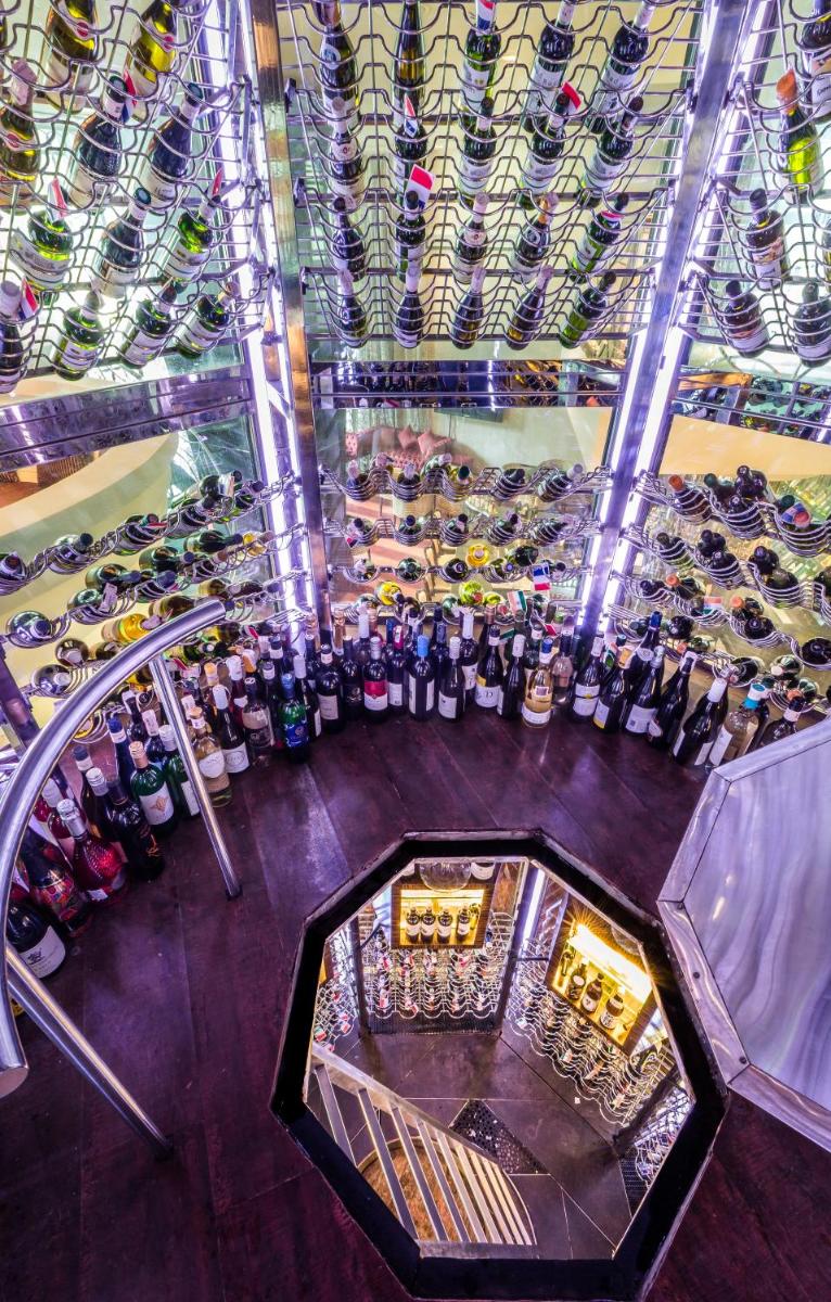 an overhead view of a wine cellar with bottles of wine at Sofitel Mumbai BKC in Mumbai