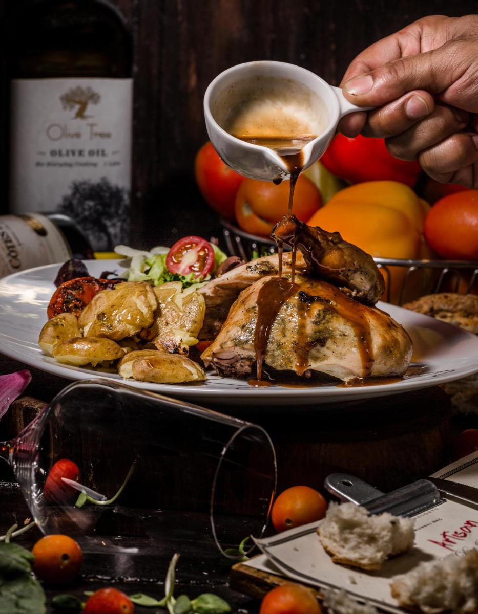 a plate of food with a turkey and vegetables at Sofitel Mumbai BKC in Mumbai