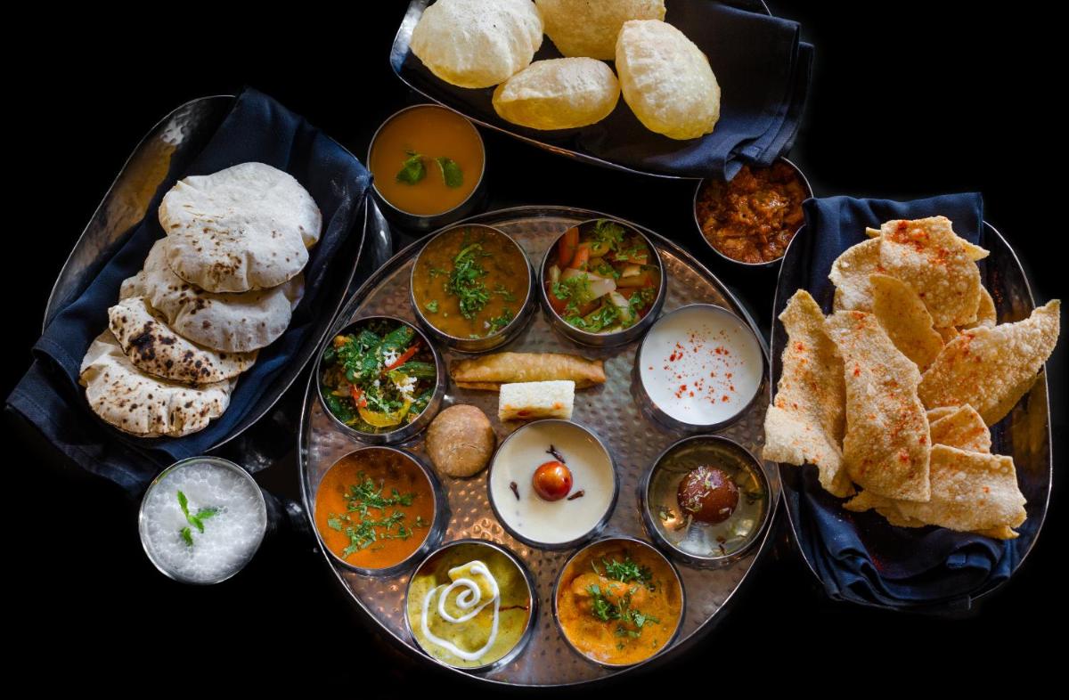 a plate of food with different types of food at Sofitel Mumbai BKC in Mumbai