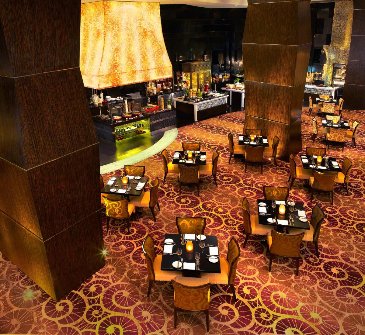 an overhead view of a restaurant with tables and chairs at Sofitel Mumbai BKC in Mumbai