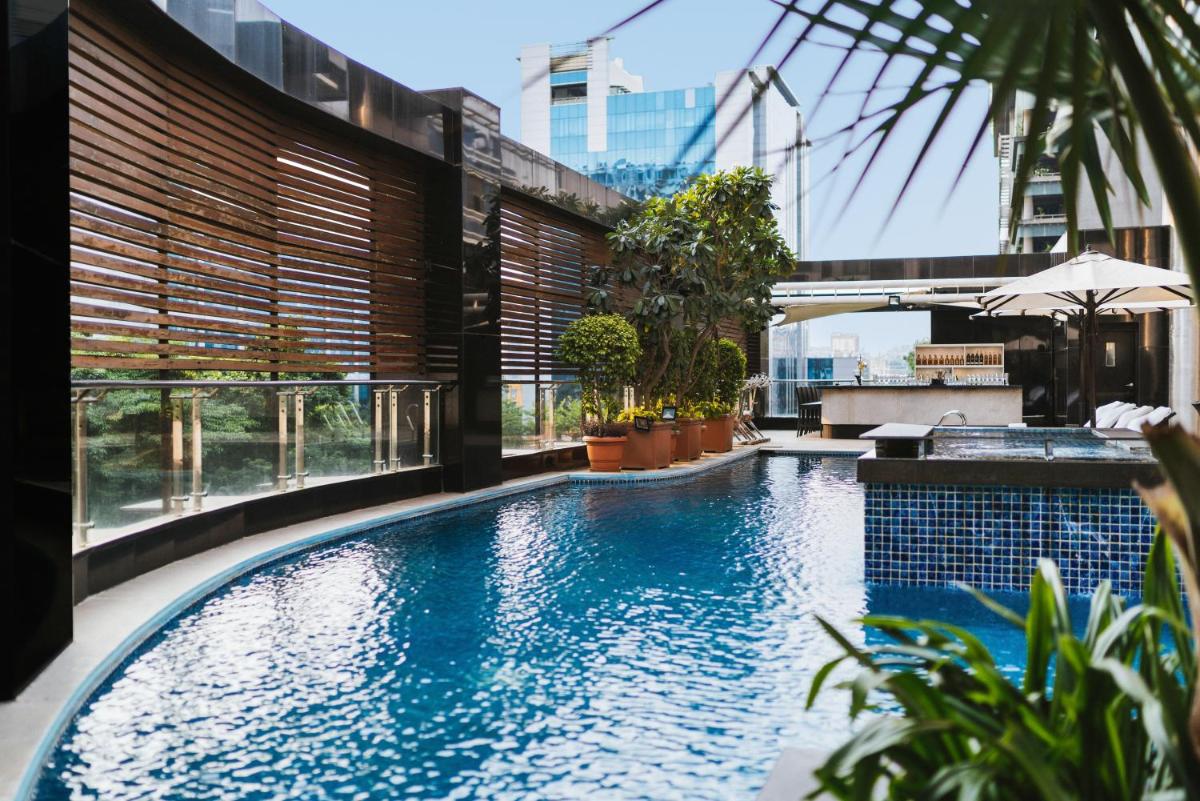 a swimming pool on top of a building at Sofitel Mumbai BKC in Mumbai