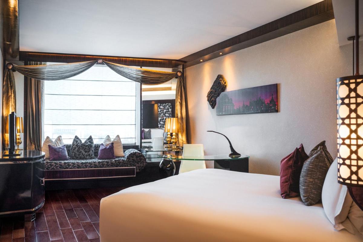 a hotel room with a bed and a window at Sofitel Mumbai BKC in Mumbai
