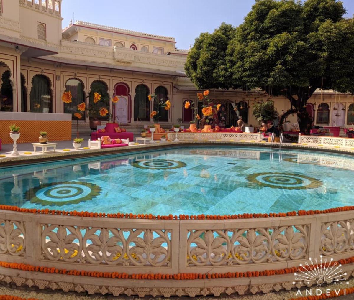 a large pool in the middle of a building at Shiv Niwas Palace by HRH Group of Hotels in Udaipur
