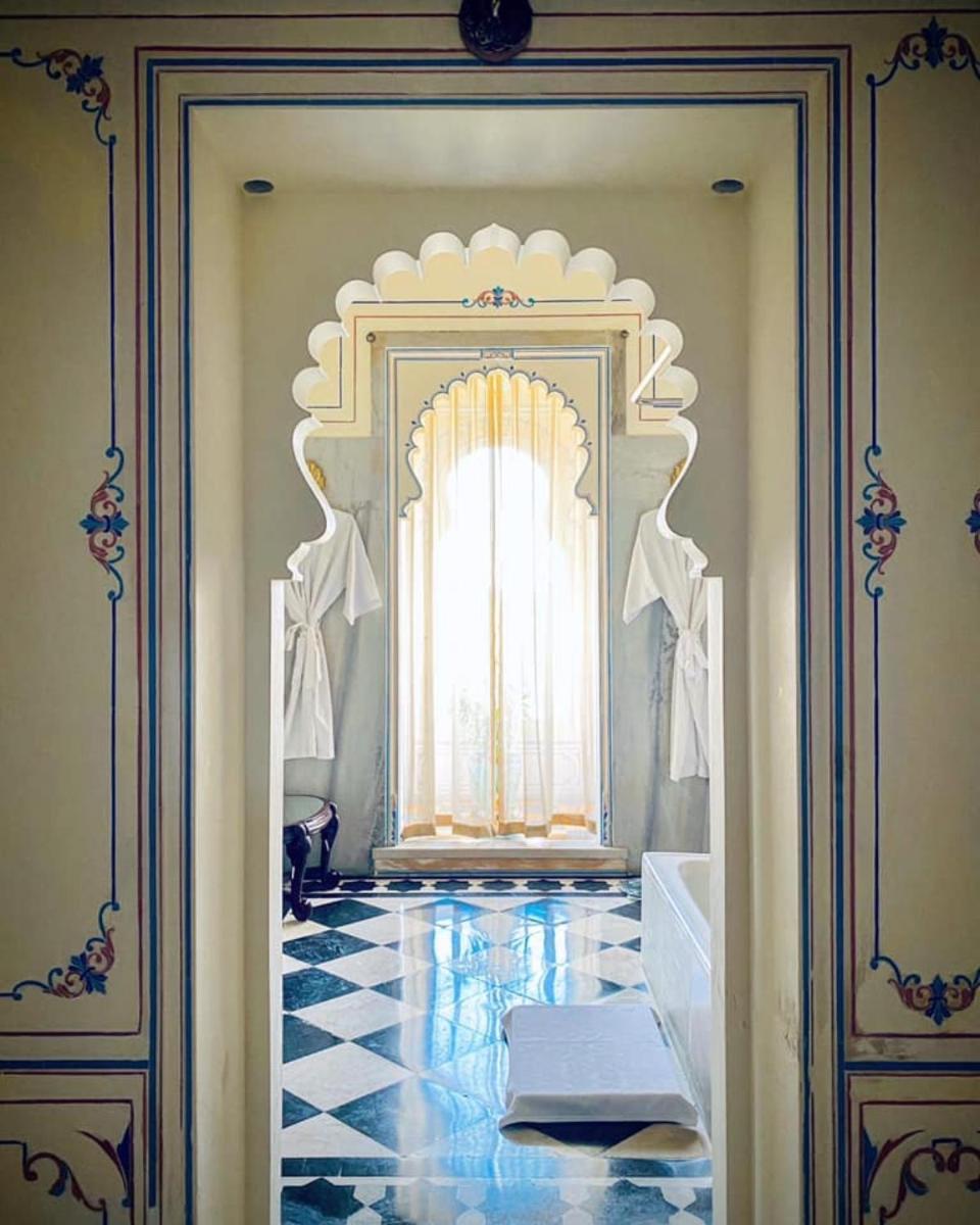 a room with a door with a window and a tile floor at Shiv Niwas Palace by HRH Group of Hotels in Udaipur