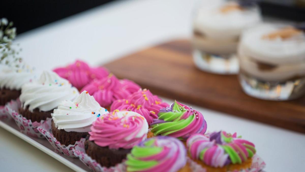 a tray of cupcakes with colorful frosting and sprinkles at InterContinental Marine Drive Mumbai by IHG in Mumbai