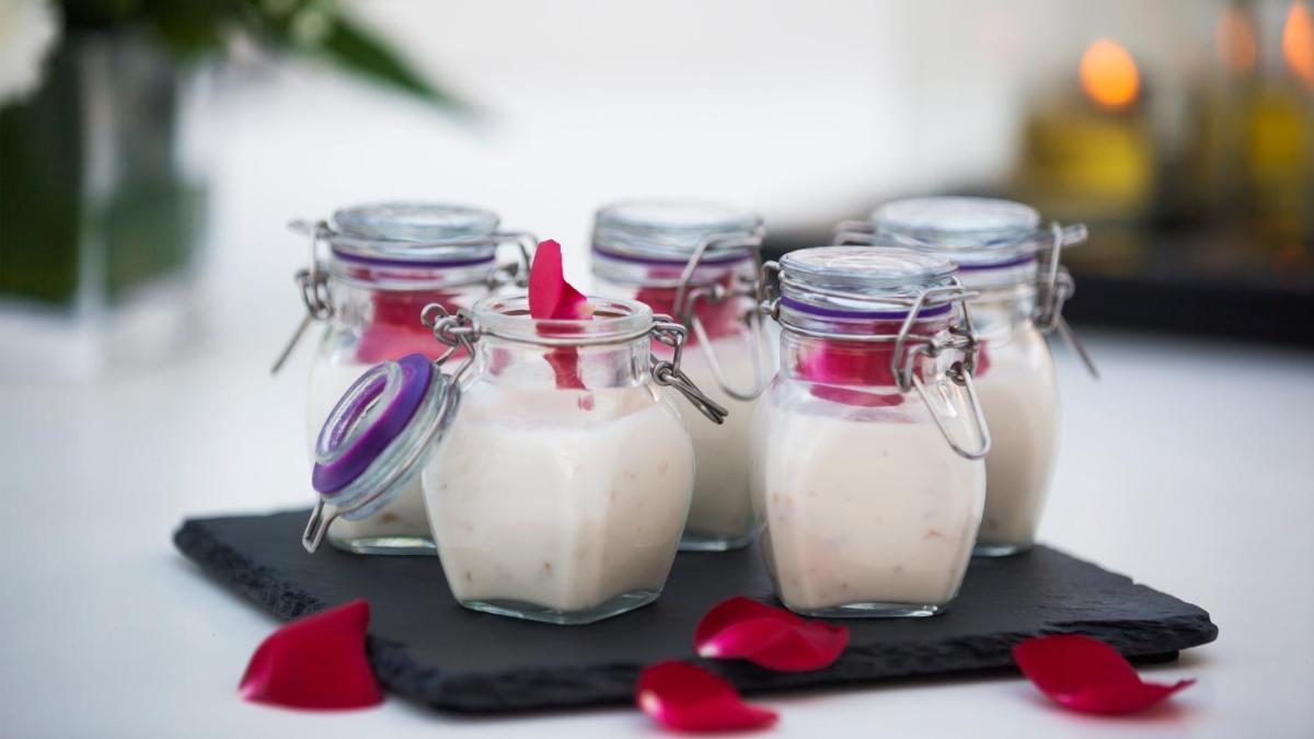 a group of glass jars filled with milk with red hearts at InterContinental Marine Drive Mumbai by IHG in Mumbai