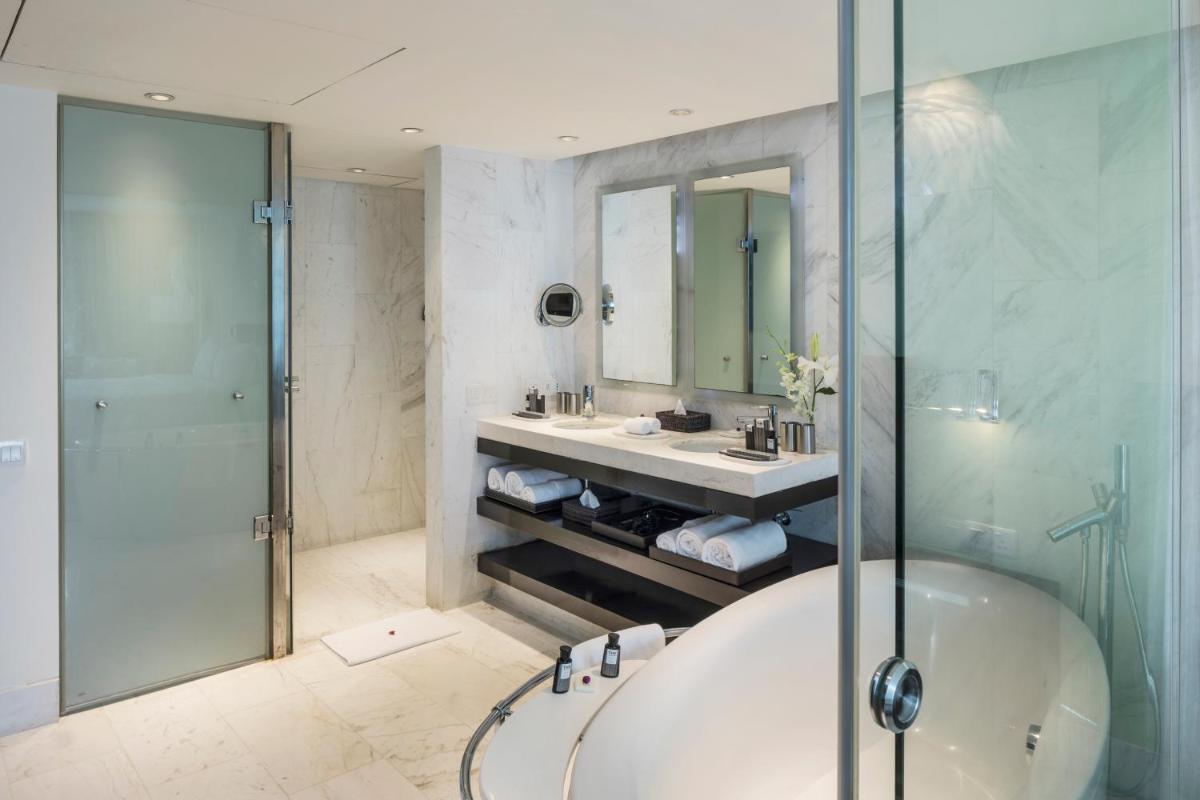 a bathroom with a tub and a sink and a shower at The Park Chennai in Chennai a bathroom with a tub and a sink and a shower at The Park Chennai in Chennai