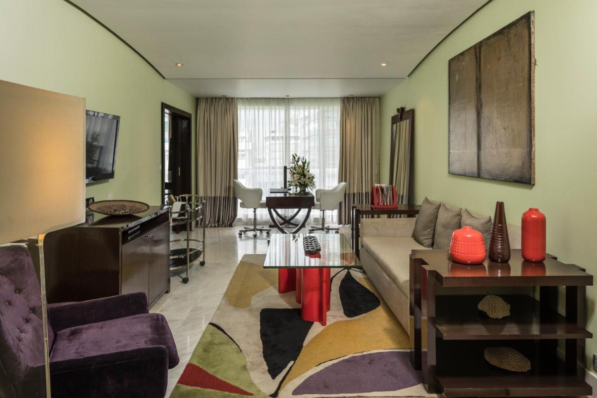 a living room with a couch and a table at The Park Chennai in Chennai a living room with a couch and a table at The Park Chennai in Chennai