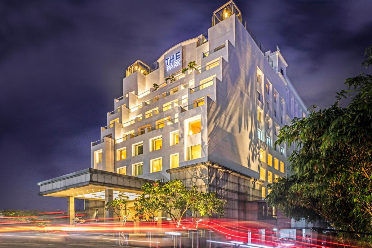 a tall building with lights in front of a street at The Park Chennai in Chennai a tall building with lights in front of a street at The Park Chennai in Chennai