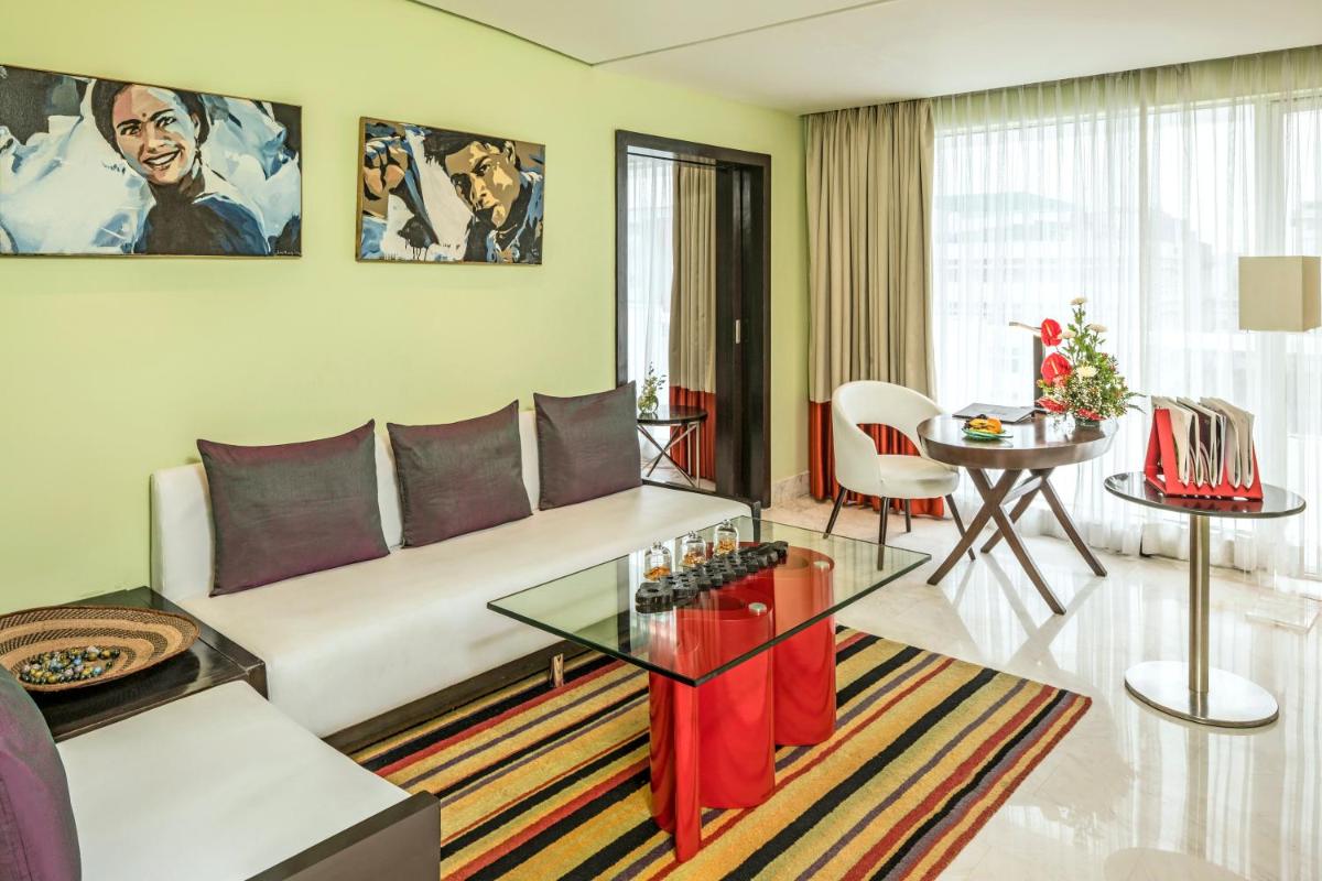 a living room with a couch and a table at The Park Chennai in Chennai a living room with a couch and a table at The Park Chennai in Chennai