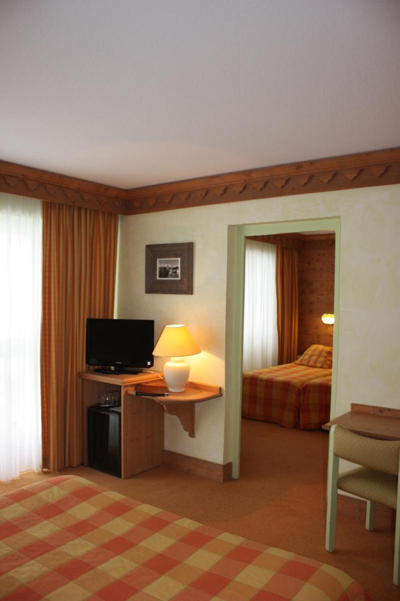 Un ou plusieurs lits dans un hébergement de l'établissement Hotel le Chalet