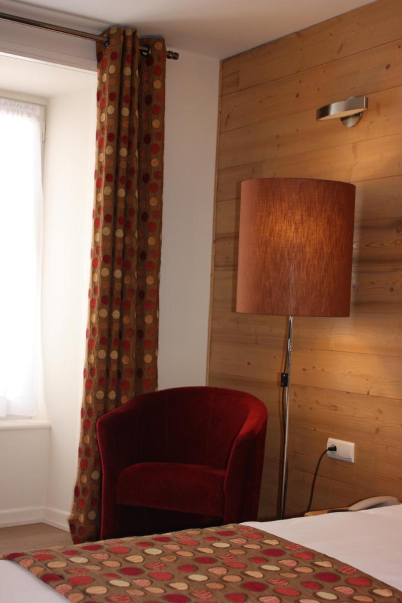 Un ou plusieurs lits dans un hébergement de l'établissement Hotel le Chalet