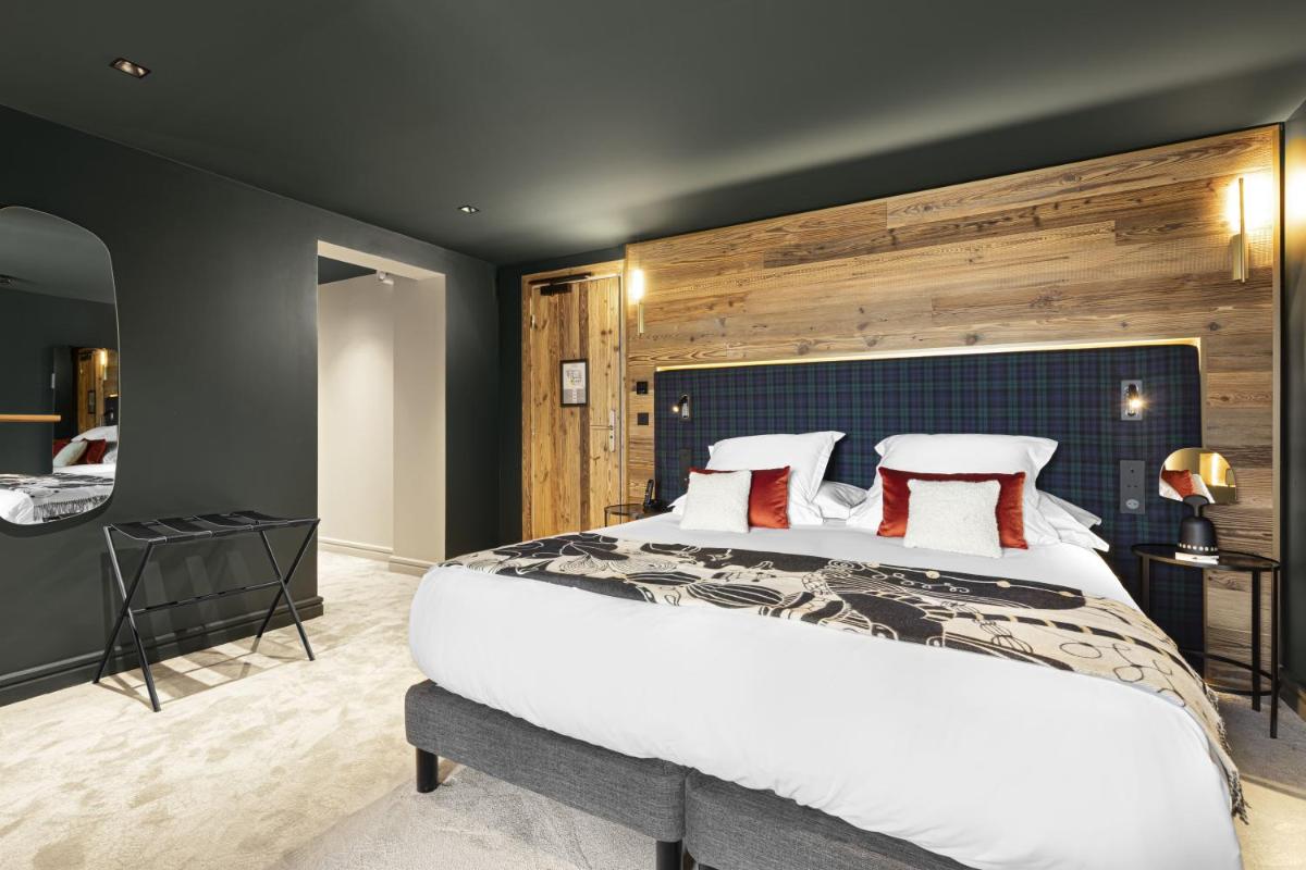 Un ou plusieurs lits dans un hébergement de l'établissement Hotel Le Chabichou