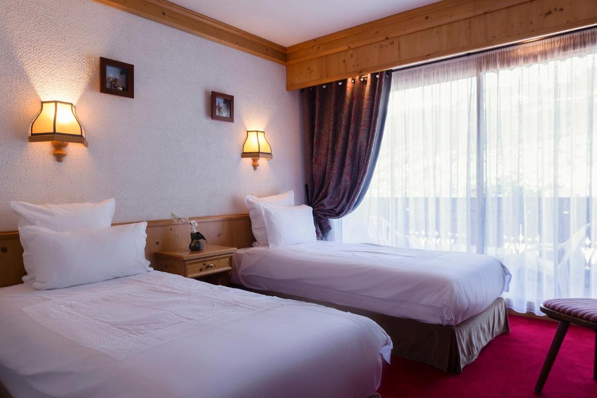 Un ou plusieurs lits dans un hébergement de l'établissement Hôtel Macchi Restaurant & Spa