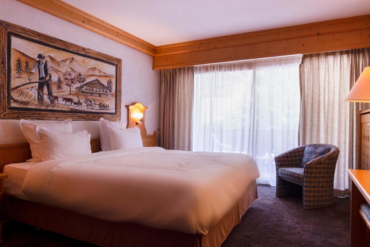 Un ou plusieurs lits dans un hébergement de l'établissement Hôtel Macchi Restaurant & Spa