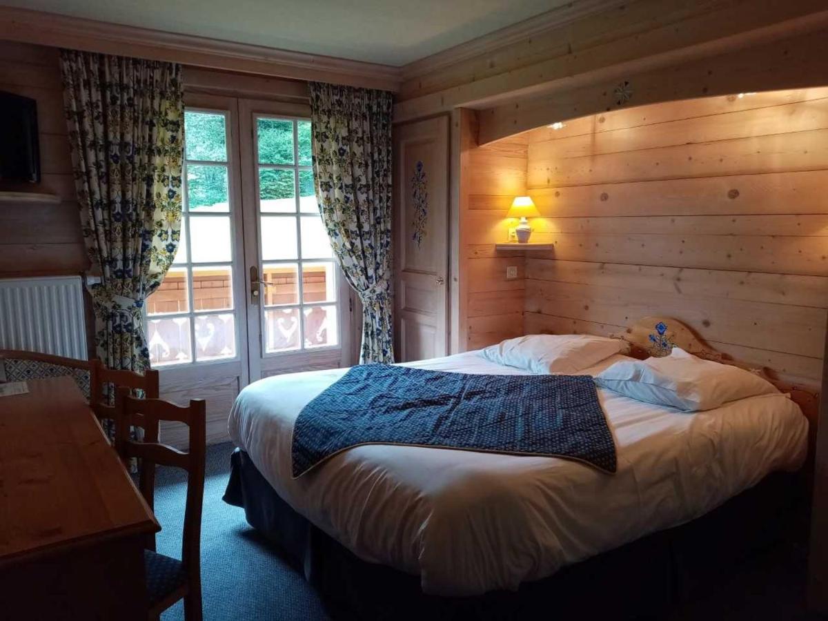 Un ou plusieurs lits dans un hébergement de l'établissement Hotel les Sapins