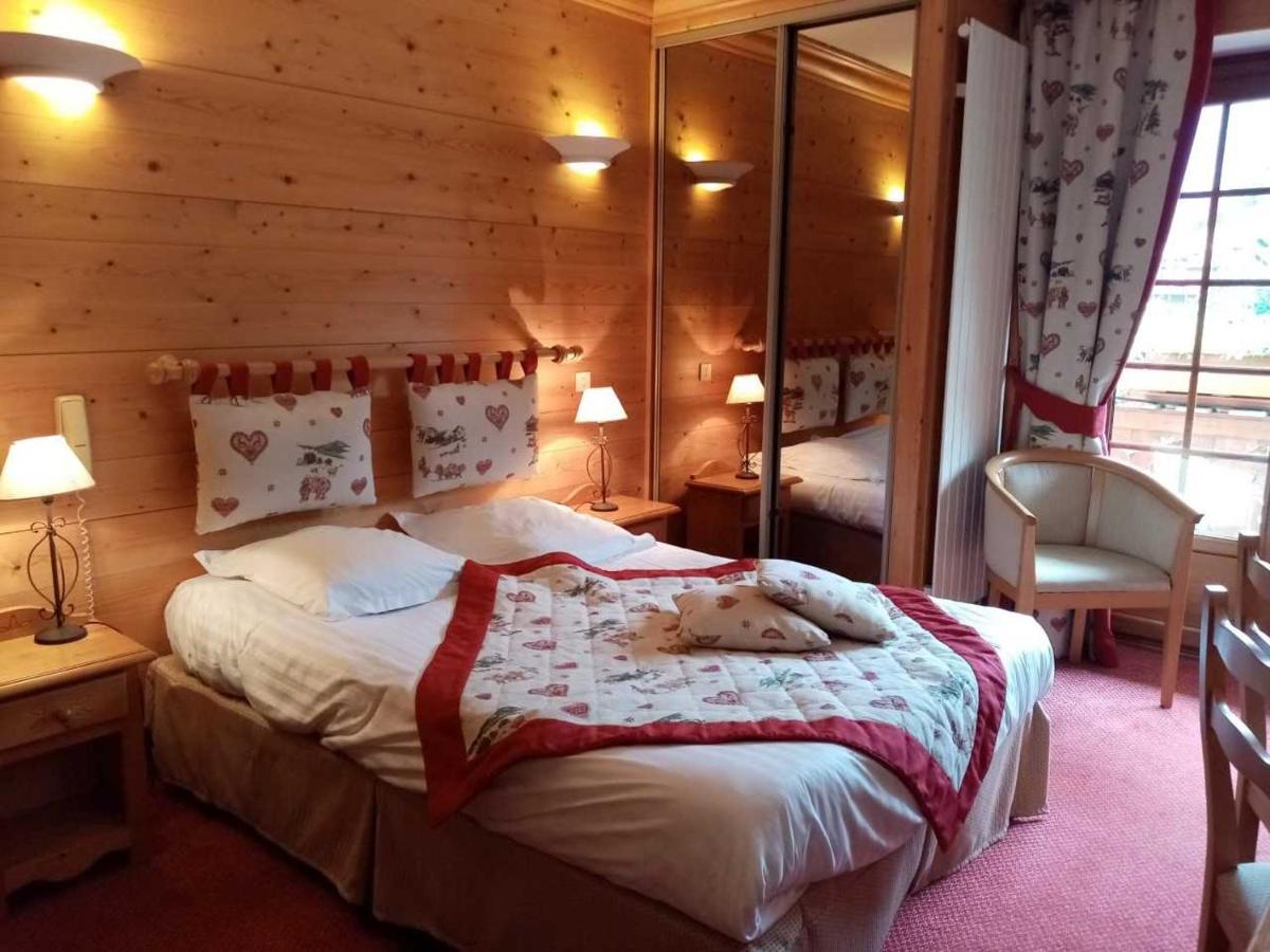 Un ou plusieurs lits dans un hébergement de l'établissement Hotel les Sapins