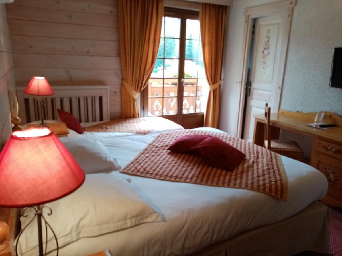 Un ou plusieurs lits dans un hébergement de l'établissement Hotel les Sapins
