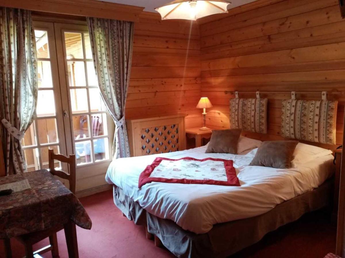 Un ou plusieurs lits dans un hébergement de l'établissement Hotel les Sapins