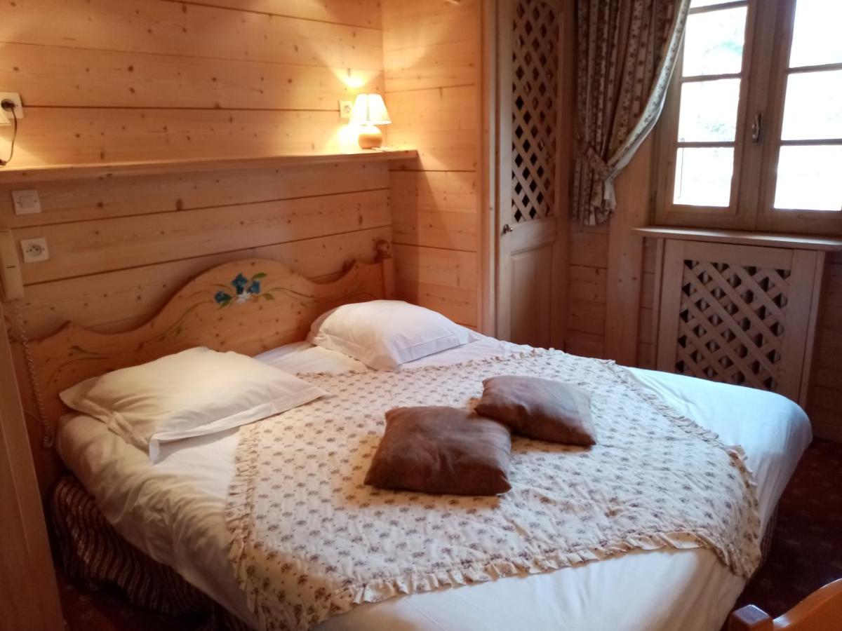 Un ou plusieurs lits dans un hébergement de l'établissement Hotel les Sapins