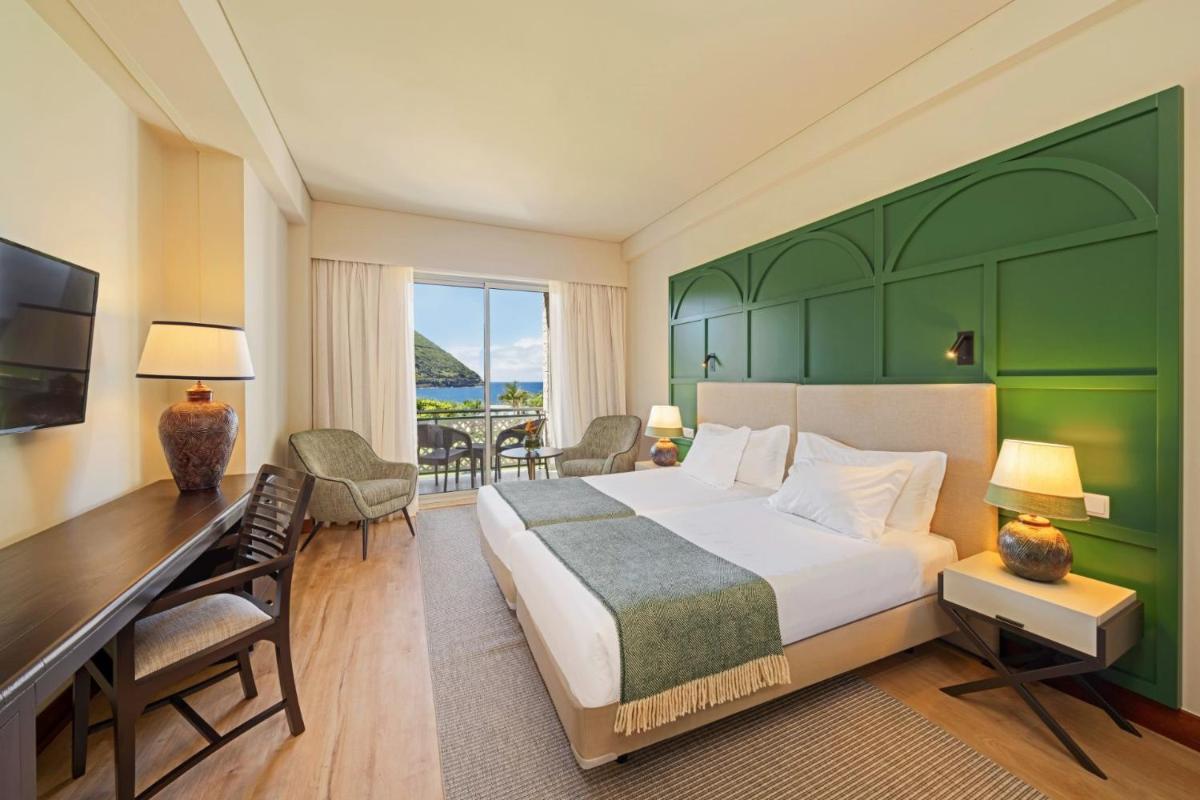 Uma cama ou camas num quarto em Terceira Mar Hotel
