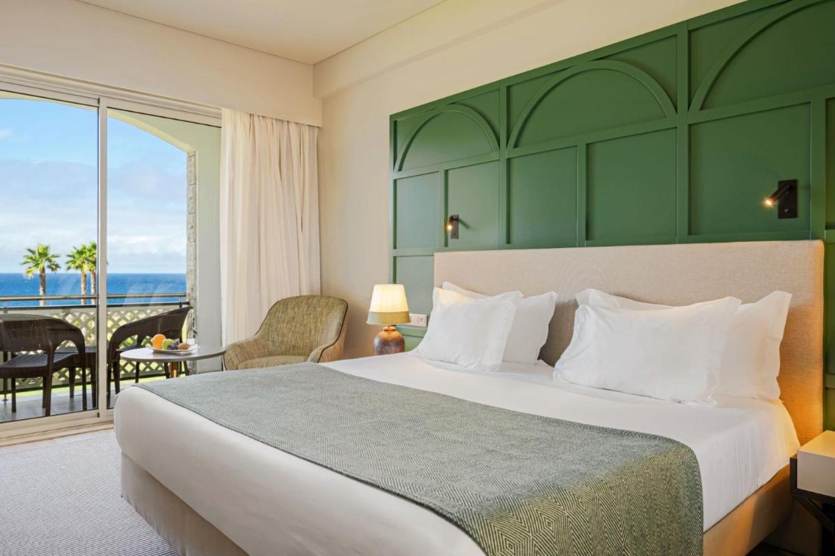 Uma cama ou camas num quarto em Terceira Mar Hotel
