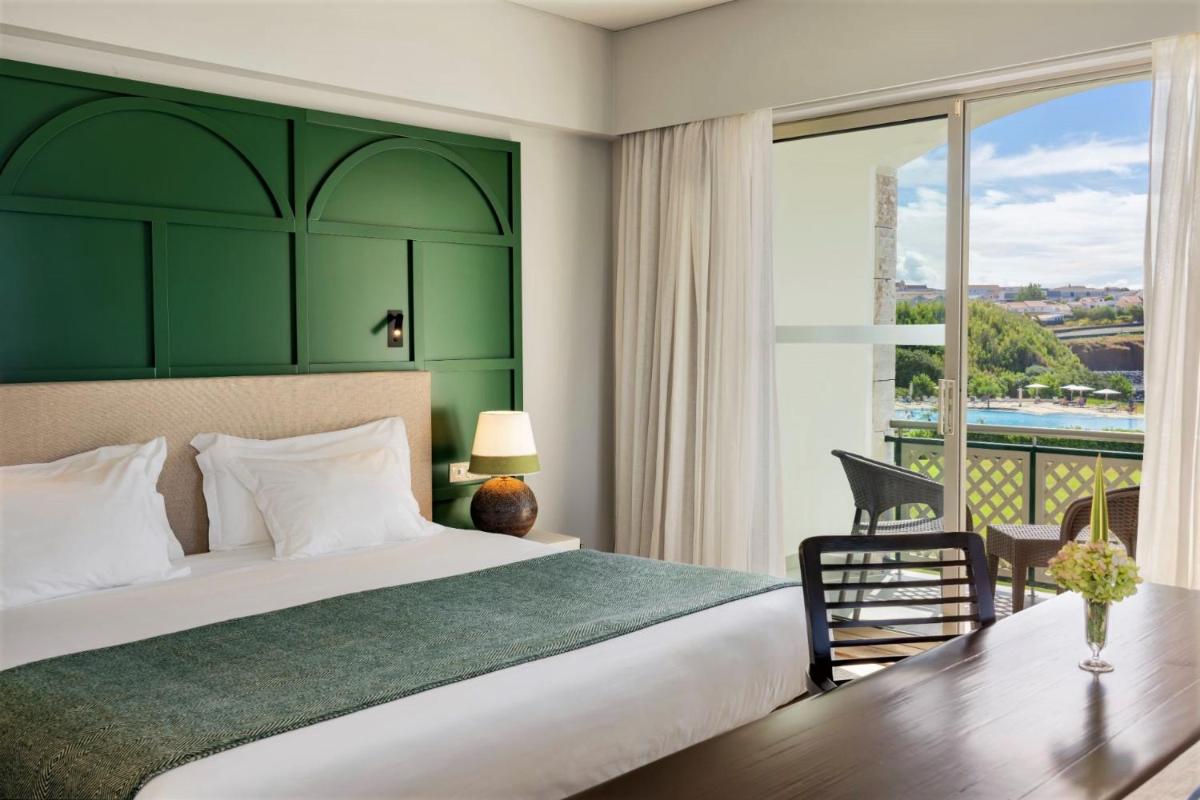 Uma cama ou camas num quarto em Terceira Mar Hotel