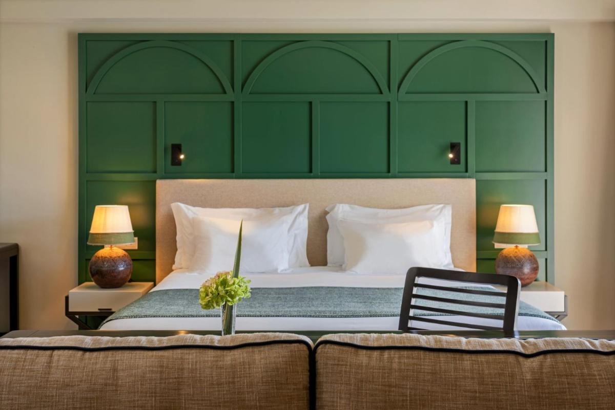 Uma cama ou camas num quarto em Terceira Mar Hotel