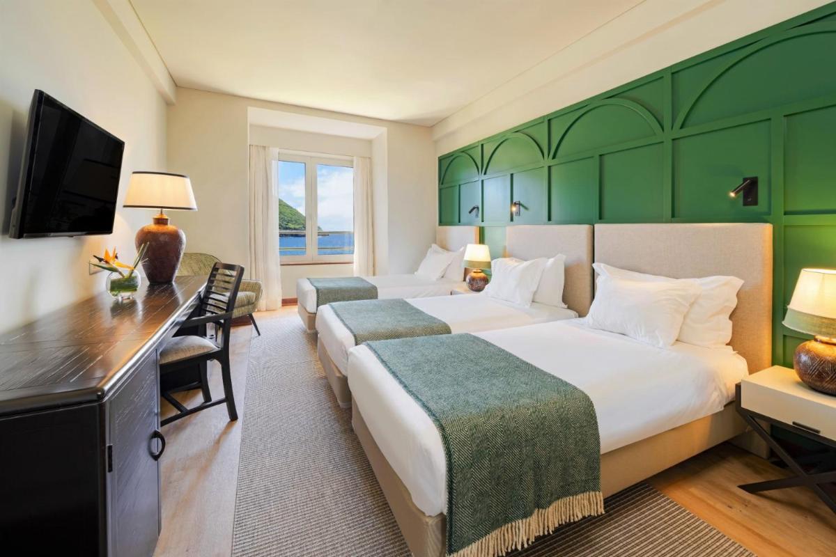 Uma cama ou camas num quarto em Terceira Mar Hotel
