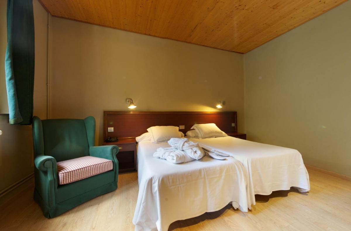 Cama o camas de una habitación en Hotel Manantial